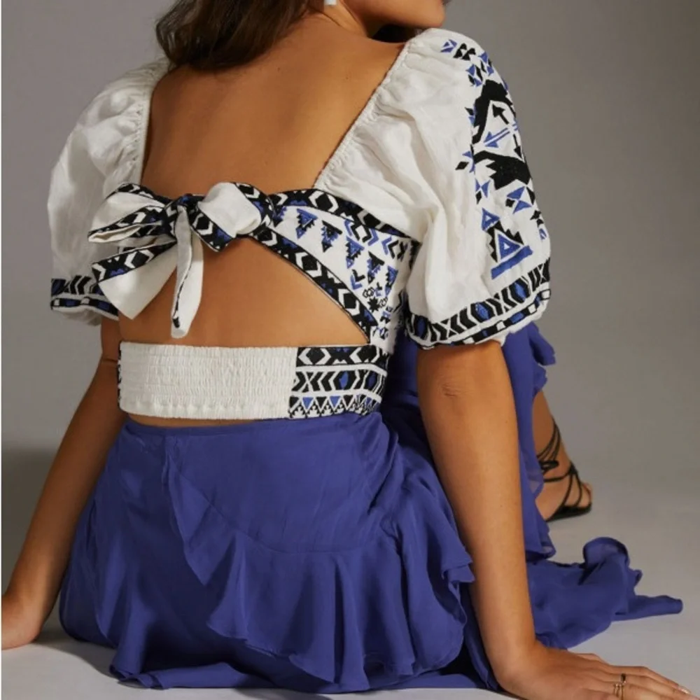 Anthropologie White Embroidered Cropped Peasant Top with Blue and Black Accents